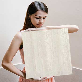 Woman holding a big tile